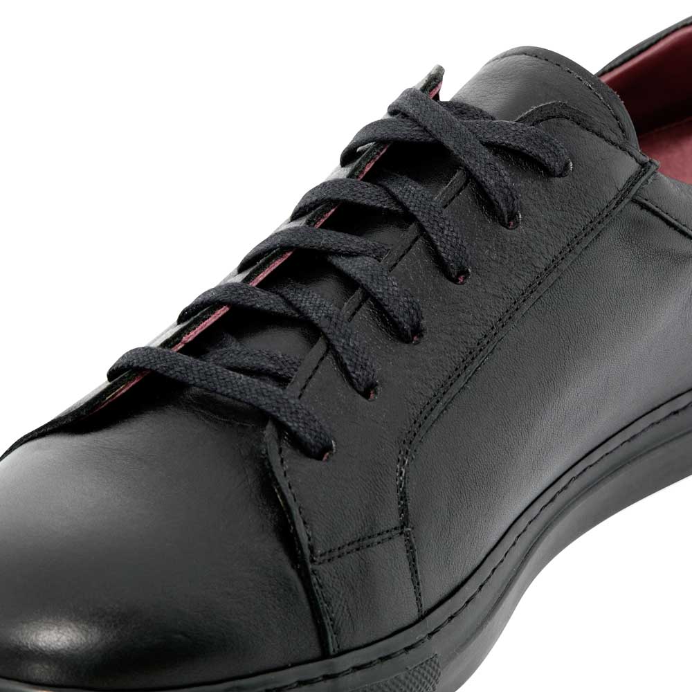black leather tennis shoe